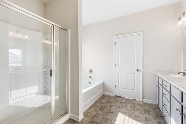 1494 Weeping Tree Cir, Auburn, GA 30548 - full bath with double vanity, a shower stall, and a garden tub