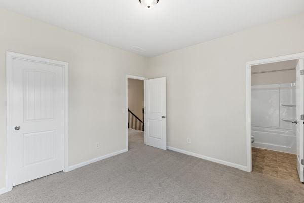 1494 Weeping Tree Cir, Auburn, GA 30548 - unfurnished bedroom featuring carpet floors and a closet