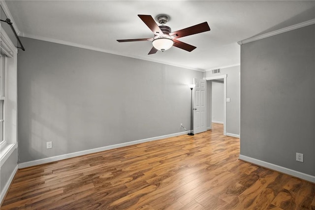 1384 N Crossing Dr NE, Atlanta, GA 30329 - spare room featuring a ceiling fan, crown molding, and wood finished floors