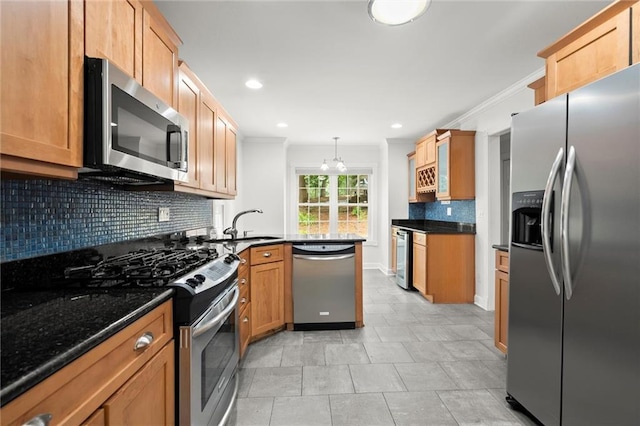 1384 N Crossing Dr NE, Atlanta, GA 30329 - kitchen featuring stainless steel appliances, a peninsula, tasteful backsplash, ornamental molding, and pendant lighting