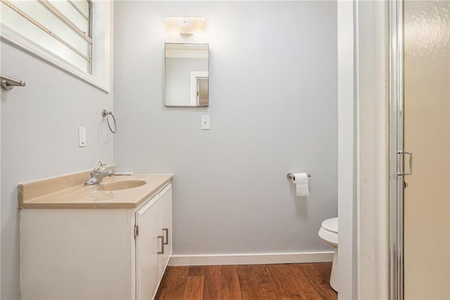 725 Bearmeat Spur, Hiawassee, GA 30546 - bathroom with toilet, baseboards, wood finished floors, and vanity