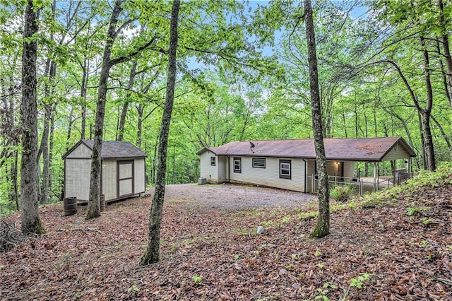 725 Bearmeat Spur, Hiawassee, GA 30546 - view of front of home with a storage shed and an outbuilding