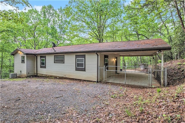 725 Bearmeat Spur, Hiawassee, GA 30546 - back of property with central air condition unit, a gate, and fence