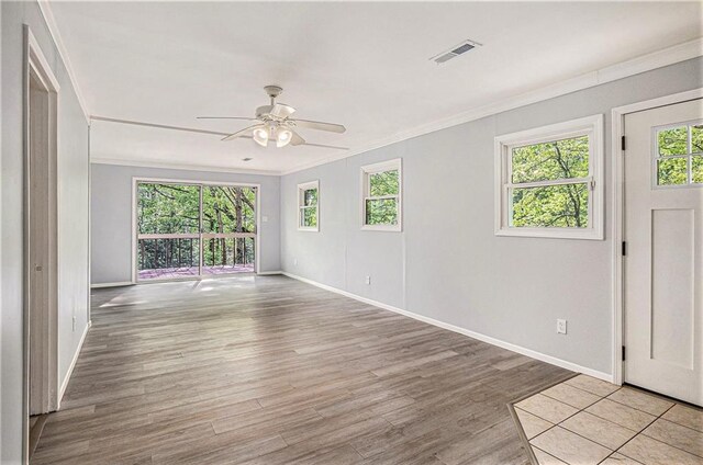 725 Bearmeat Spur, Hiawassee, GA 30546 - interior space with baseboards, visible vents, ornamental molding, and plenty of natural light