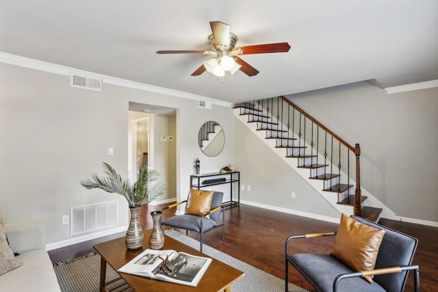 living room with ceiling fan, dark wood-type flooring, and ornamental molding