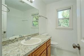 bathroom with vanity and toilet