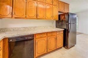 kitchen with black appliances and brown cabinets