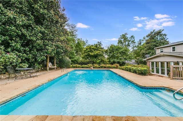 outdoor pool with a patio