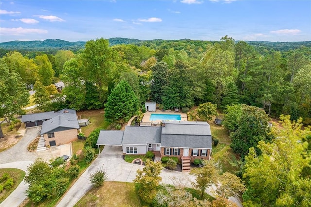 drone / aerial view featuring a view of trees