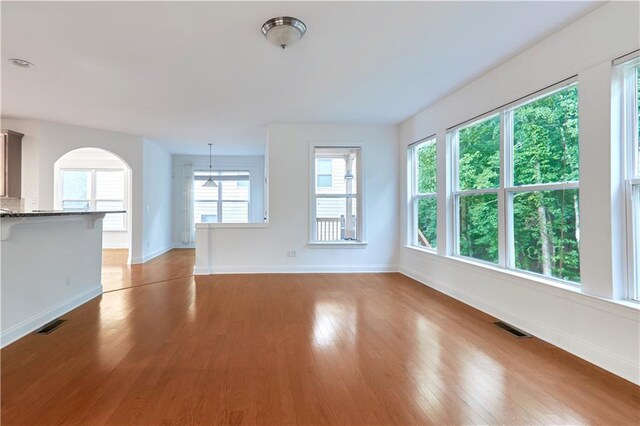 unfurnished living room featuring light hardwood / wood-style floors