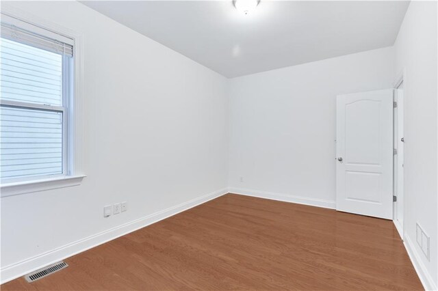 spare room featuring hardwood / wood-style flooring