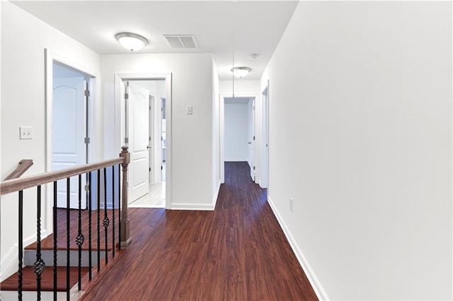 hall featuring dark wood-type flooring