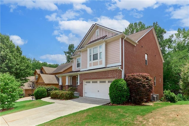 view of front of house featuring central AC, a garage, and a front lawn