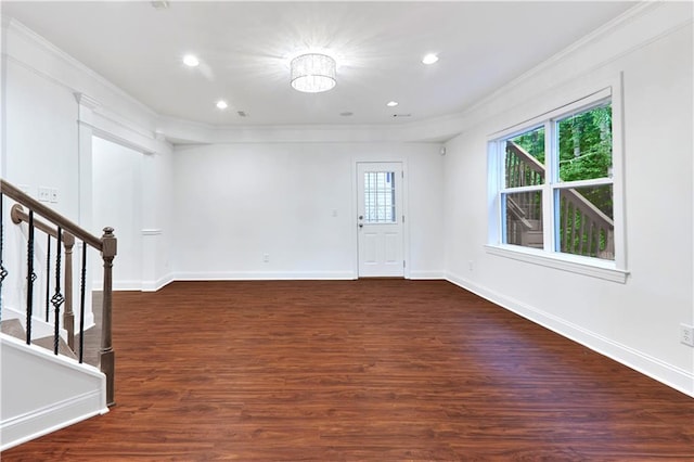 unfurnished room featuring dark hardwood / wood-style floors and ornamental molding