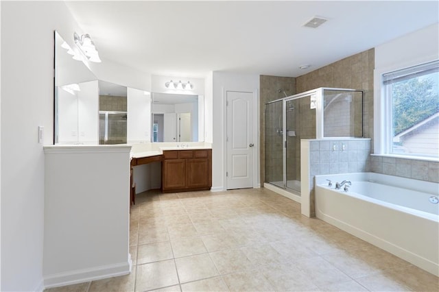 bathroom with tile patterned flooring, shower with separate bathtub, and vanity