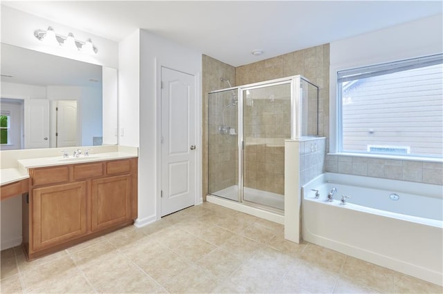 bathroom with tile patterned floors, vanity, and independent shower and bath