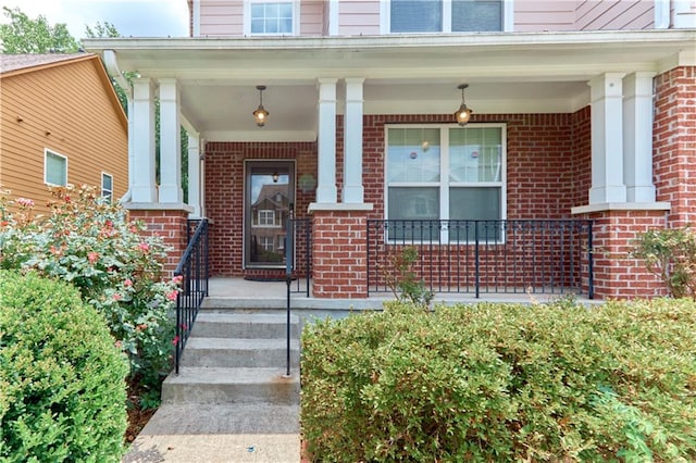 property entrance featuring covered porch