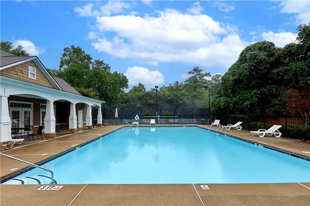 view of swimming pool with a patio area