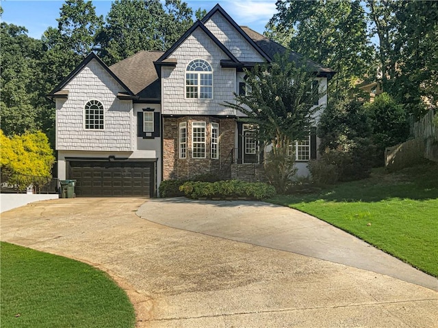 view of front facade featuring a garage and a front lawn