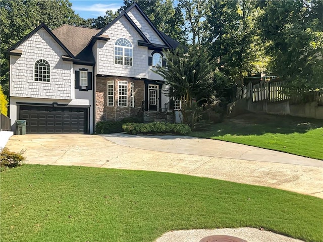 view of front facade with a front yard and a garage