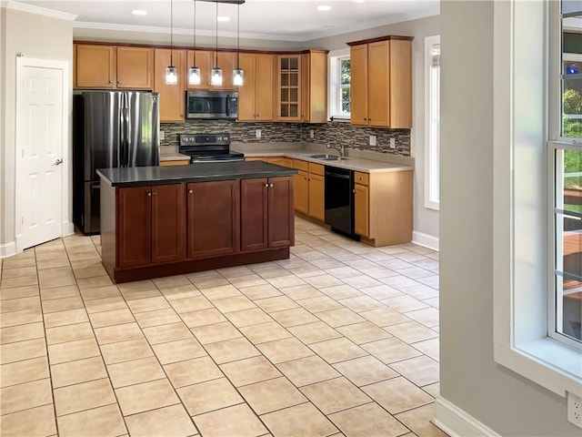 kitchen featuring a kitchen island, a healthy amount of sunlight, stainless steel appliances, and tasteful backsplash