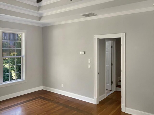 unfurnished room featuring dark hardwood / wood-style flooring and ornamental molding