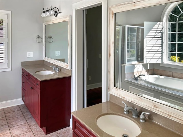 bathroom with tile patterned flooring, vanity, and plus walk in shower