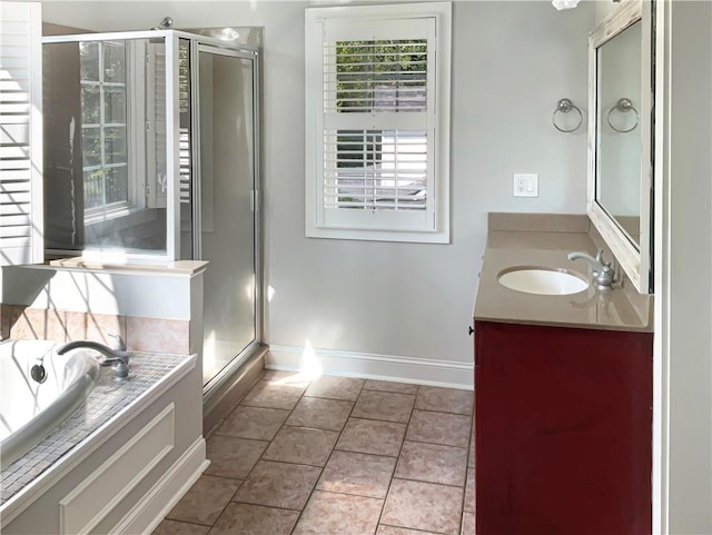 bathroom with vanity, tile patterned floors, and shower with separate bathtub