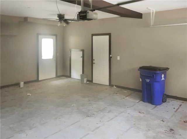 garage featuring ceiling fan and a garage door opener