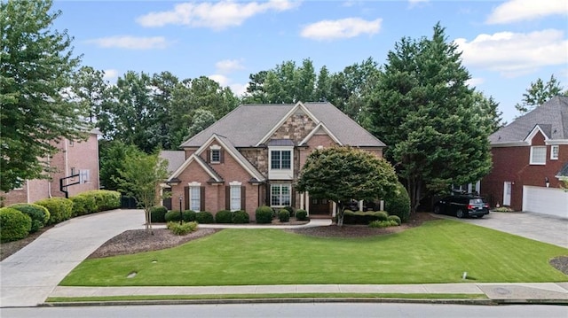 3560 Greenside Ct, Dacula, GA 30019 - craftsman house with a front yard, stone siding, and driveway