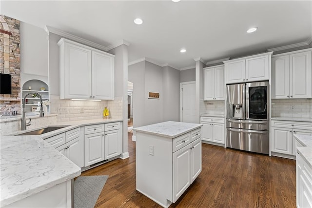3560 Greenside Ct, Dacula, GA 30019 - kitchen featuring stainless steel fridge, decorative backsplash, recessed lighting, white cabinetry, and crown molding