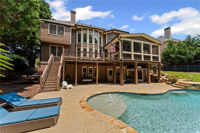 3560 Greenside Ct, Dacula, GA 30019 - back of house featuring stairway, a patio, a chimney, a deck, and a sunroom