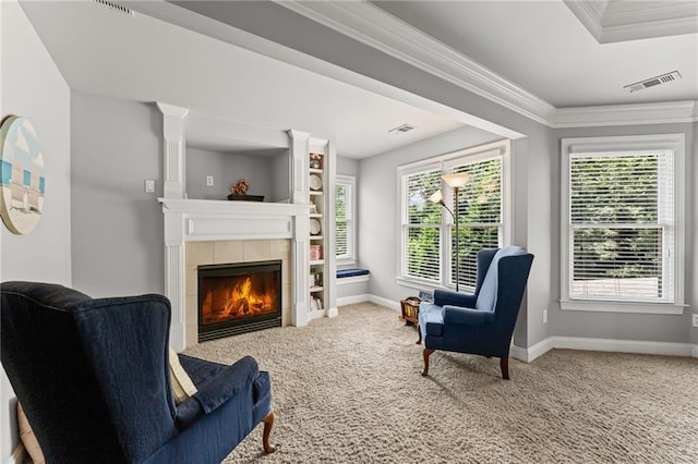 3560 Greenside Ct, Dacula, GA 30019 - living area featuring carpet floors, crown molding, and a tiled fireplace