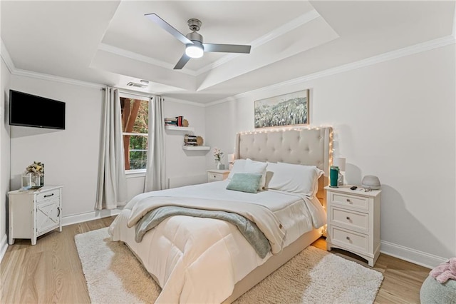 3560 Greenside Ct, Dacula, GA 30019 - bedroom featuring a raised ceiling, light wood-style flooring, crown molding, and a ceiling fan
