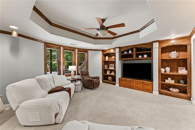 3560 Greenside Ct, Dacula, GA 30019 - carpeted living area featuring ornamental molding, a raised ceiling, ceiling fan, and built in shelves