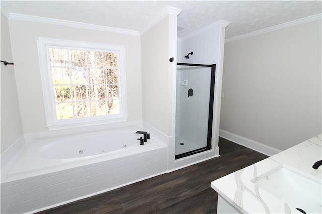 bathroom featuring vanity, separate shower and tub, and crown molding