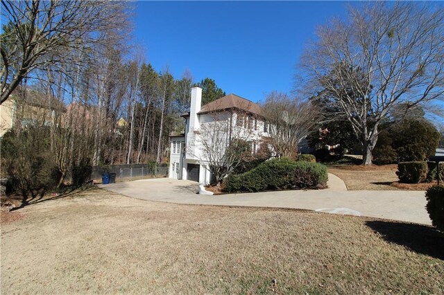 view of side of home with a garage