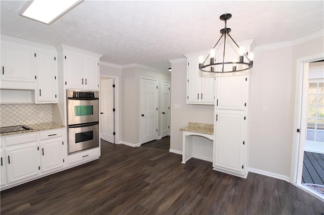 kitchen with pendant lighting, white cabinetry, double oven, and light stone counters