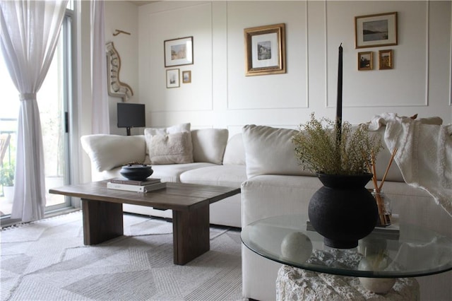 711 Cosmopolitan Dr Unit 413, Atlanta, GA 30324 - living area featuring light carpet and a decorative wall