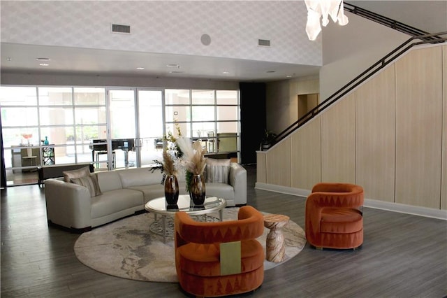 711 Cosmopolitan Dr Unit 413, Atlanta, GA 30324 - living room featuring wood finished floors, stairway, and wallpapered walls