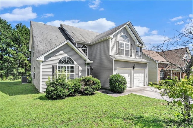 view of front property with a front lawn, central AC unit, and a garage