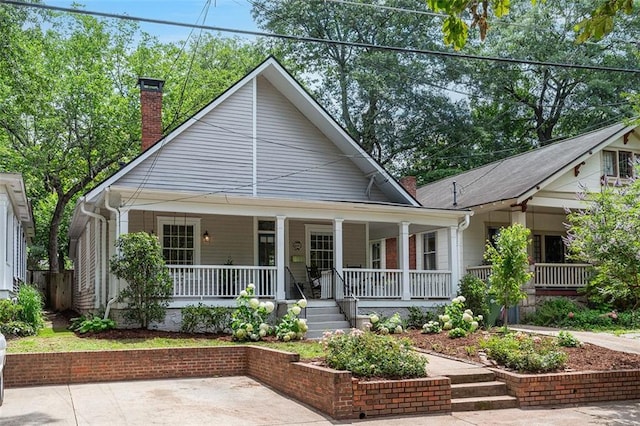 343 Josephine St NE, Atlanta, GA 30307 - view of front of home featuring covered porch and a chimney