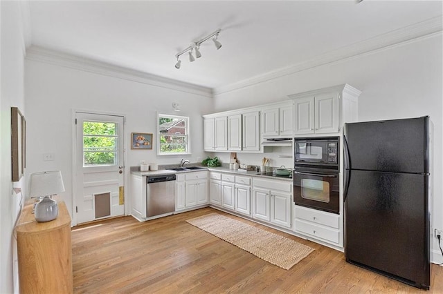 343 Josephine St NE, Atlanta, GA 30307 - kitchen with black appliances, white cabinets, light wood finished floors, light countertops, and ornamental molding