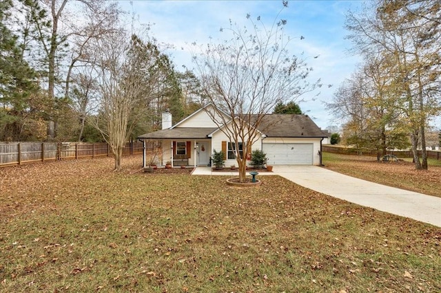 view of front of property with a garage, a front yard, and covered porch