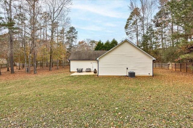 view of home's exterior with central AC and a lawn