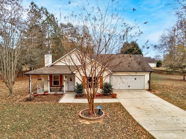 view of front facade with a garage, covered porch, and a front lawn