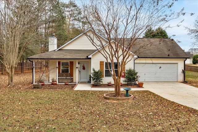 view of front facade with a porch, a garage, and a front yard