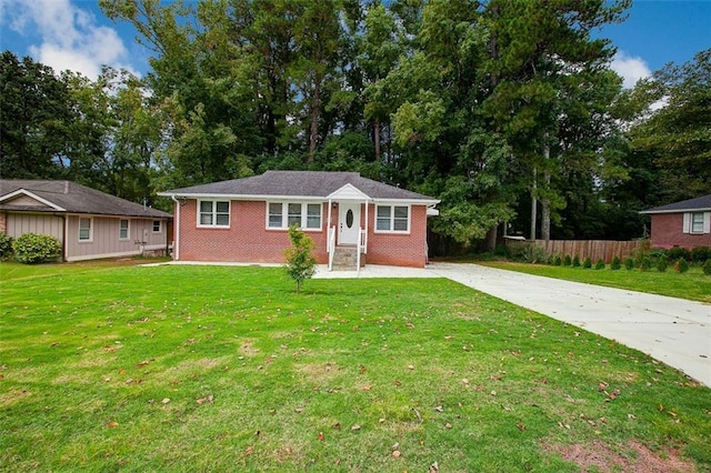 ranch-style home with a front yard