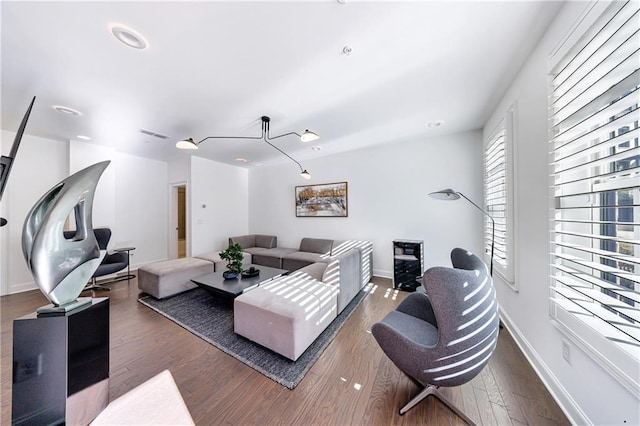 living room with dark hardwood / wood-style flooring