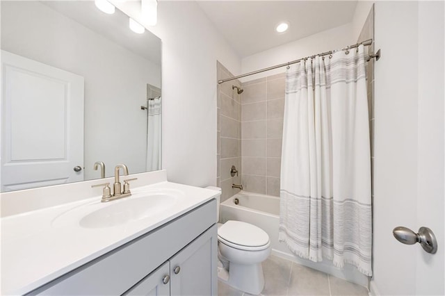 full bathroom featuring toilet, vanity, tile patterned floors, and shower / tub combo with curtain